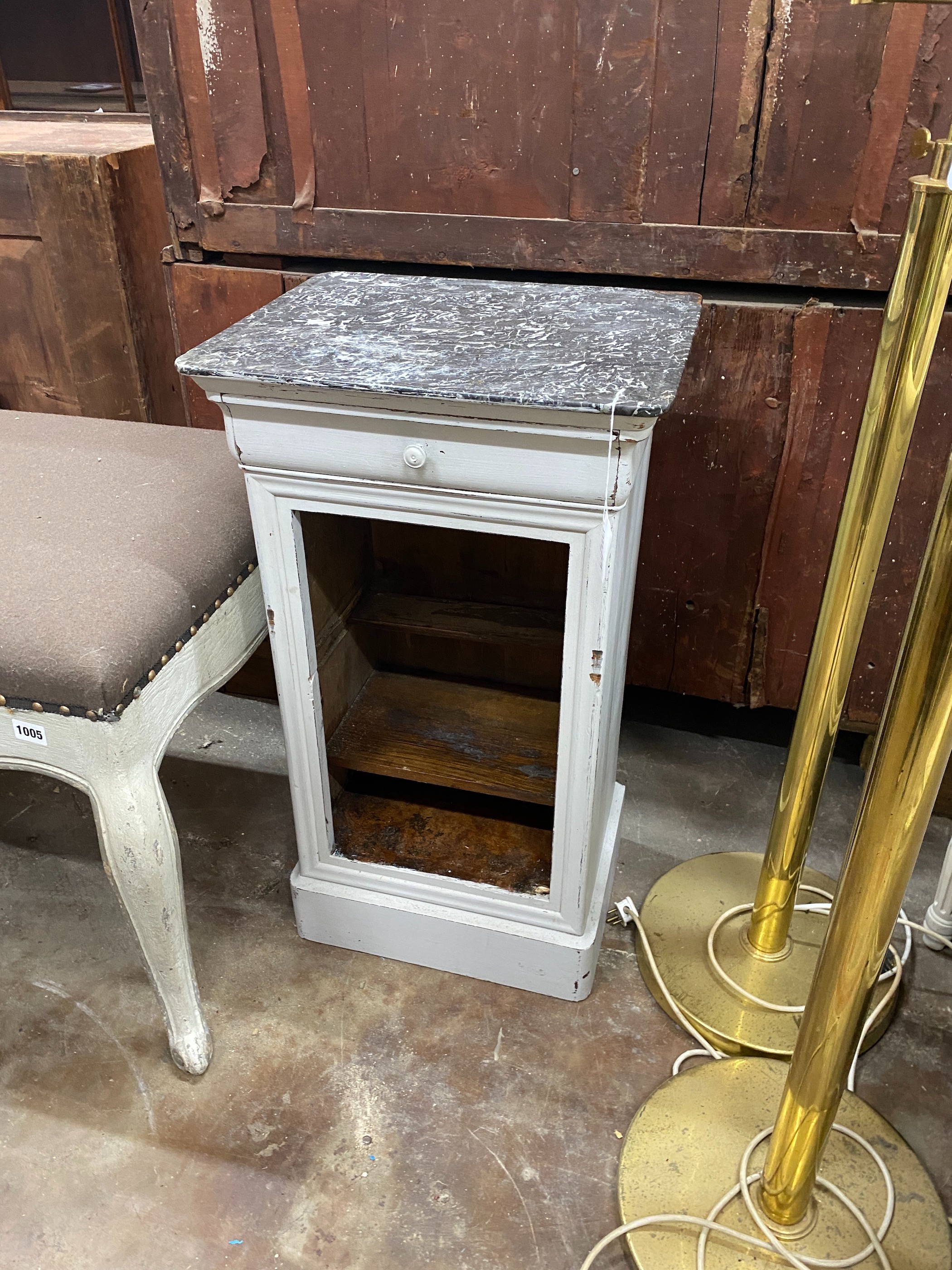 A 19th century French painted black marble topped bedside cabinet, (lacking door), width 42cm, depth 34cm, height 74cm